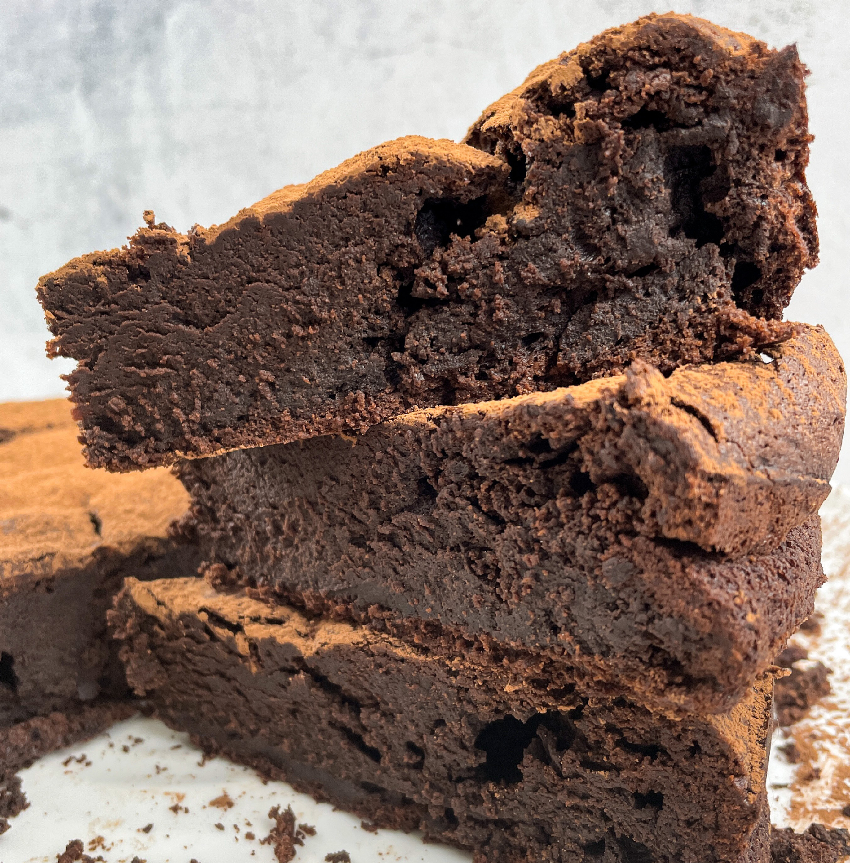Stack of slices of flourless chocolate cake