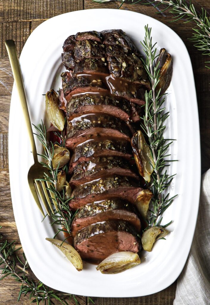 slow-roasted beef tenderloin with roasted shallots and port wine sauce